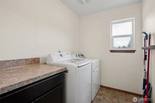 The laundry room is more than just a place for laundry, it’s a space for everything you need. With a counter for folding, crafting, or gift wrapping, plus cabinets for extra storage, this room’s got you covered. And don’t forget the brand-new LG washer, easy vinyl floors, and a window that opens for that fresh-air vibe.