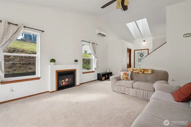 Anchoring the room with a clean, modern presence, this gas fireplace is a delight highlight of this beautiful space.  Framed by two oversized windows and surrounded by comfortable, light-filled living space, it’s a beautiful focal point with a warm future ahead.