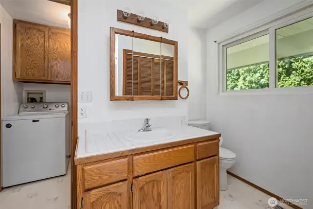 Guest bathroom looking through to laundry room