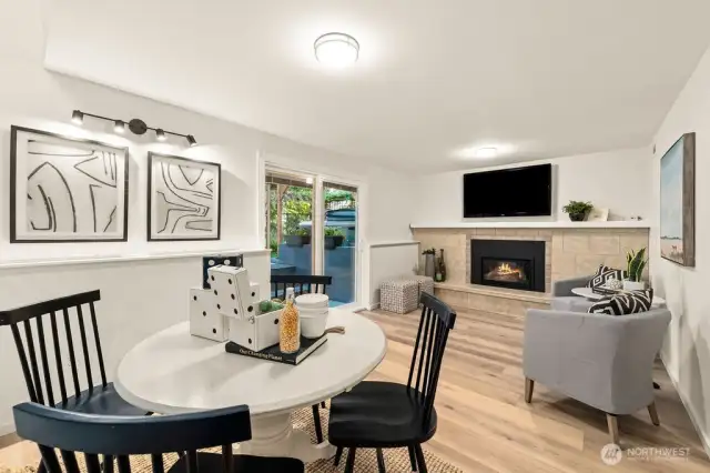 Open bonus room wih fireplace and slider to the back patio and hot tub.