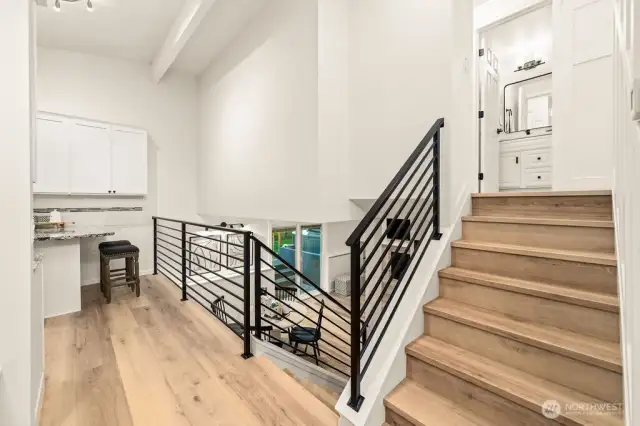 Hallway with modern railing to all levels.