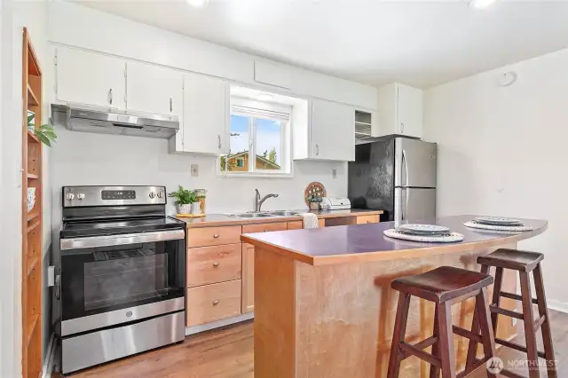 A stylish kitchen with stainless steel appliances complemented by inviting wood cabinets.