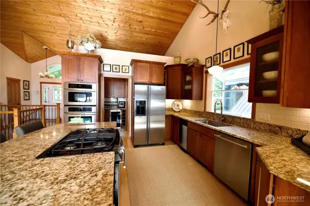 Gorgeous granite, stainless steel appliances, & cherry-wood cabinets.