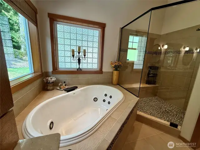 Elegant spacious shower w/ bench.