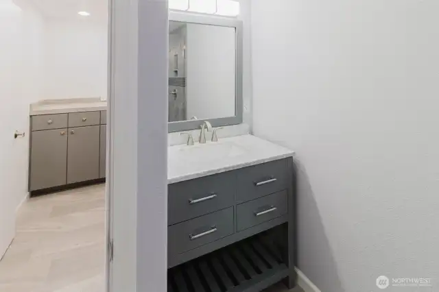 Convenience is key with a 3/4 bath located on the main floor, just steps from the laundry room. It’s tucked away near the office, which could easily serve as a main-floor primary bedroom if desired.