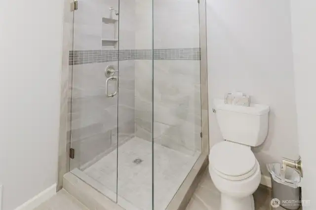 The 3/4 bath on the first floor with access to the "office area".