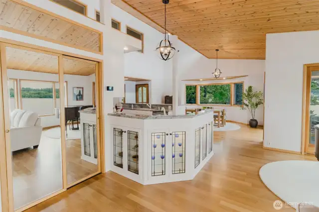Welcome home to this beautiful Northwest Style home filled with beautiful wood flooring and ceilings throughout this home.  The wood wrapped windows and stylish lighting top this home off.