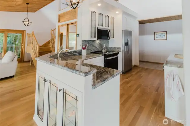 Beautiful granite countertops with high end cabinetry are enhanced by the new convection range, stainless steel refrigerator and dishwasher.