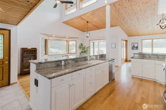 White cabinets, beautiful wood and stainless steel appliances make this home pop.