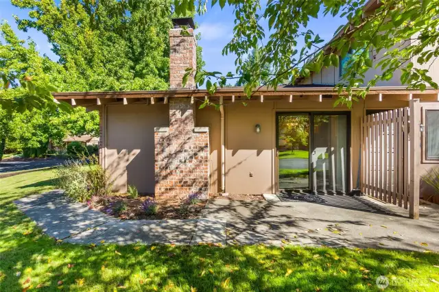 A glass slider at the back of the home opens to a private patio.