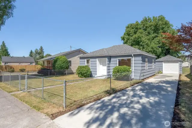Fully fenced yard and new driveway.