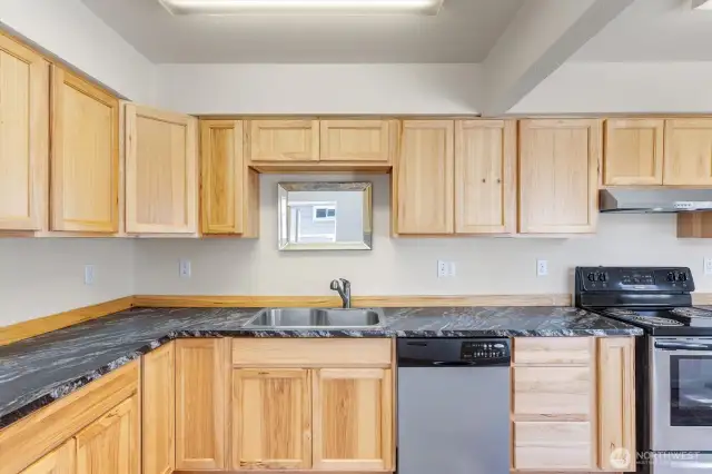 Updated kitchen with tons of storage space.
