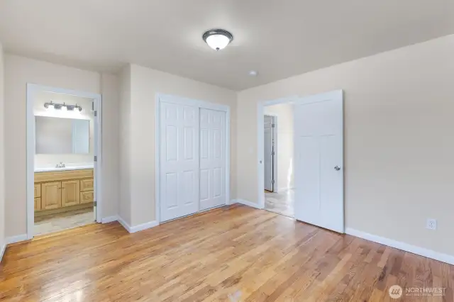 Primary bedroom and full bathroom.