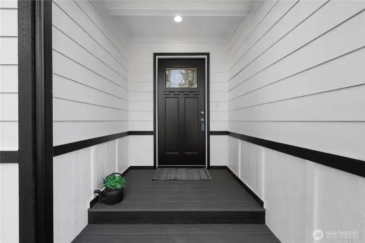 Covered front door and trex deck.