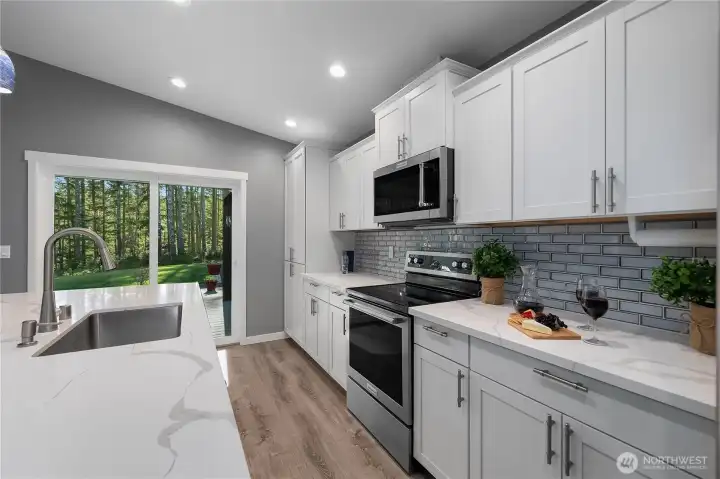 Kitchen view to back patio slider.