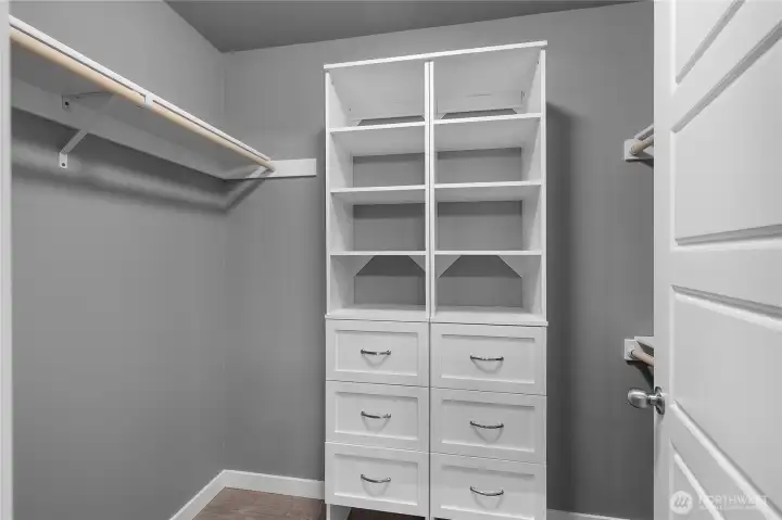 Primary closet with closet system installed and thought out.