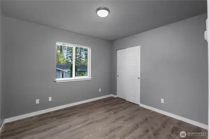 Bedroom 3 looks to the side of the home.