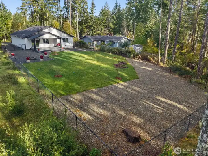 The back fence line is not the back property line - it goes into the trees.