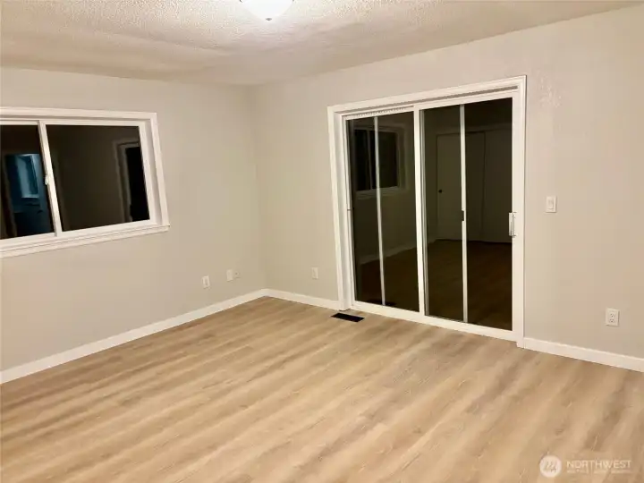 Primary bedroom has multiple closets and it's own deck off the back.