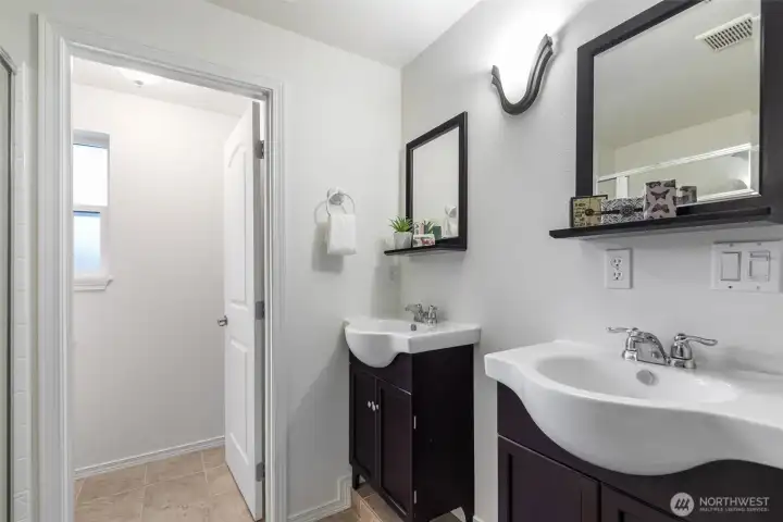 ...an ensuite bath with dual sinks, separate water closet...