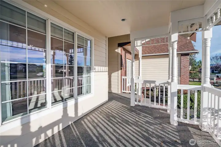 Covered Front porch facing South for lots of sun.