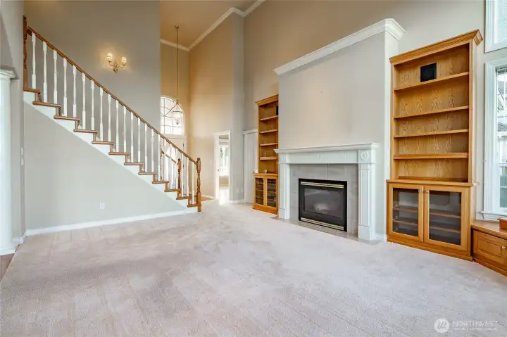 Living Room Entry in the background primary to the right. Kitchen and eat in kitchen to the left.
