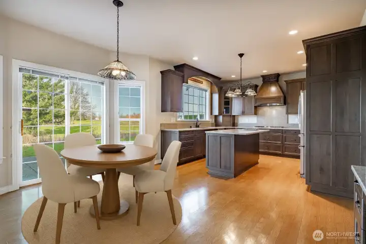 Virtually Staged dining area and the beautiful kitchen.
