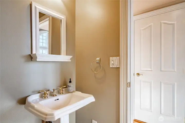 Main floor 1/2 bathroom.out the door to the left is the formal dining/Family Room. To the right goes into the kitchen dining area.