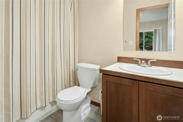 Attached full bath creates a true lower-level retreat.