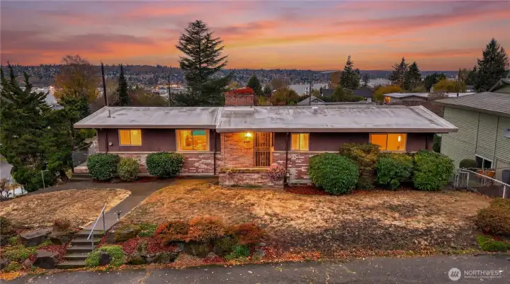 Daylight rambler in sought after Upper Kennydale in Renton. Amazing sunsets, the Olympic mountains, and partial Lake Washington views