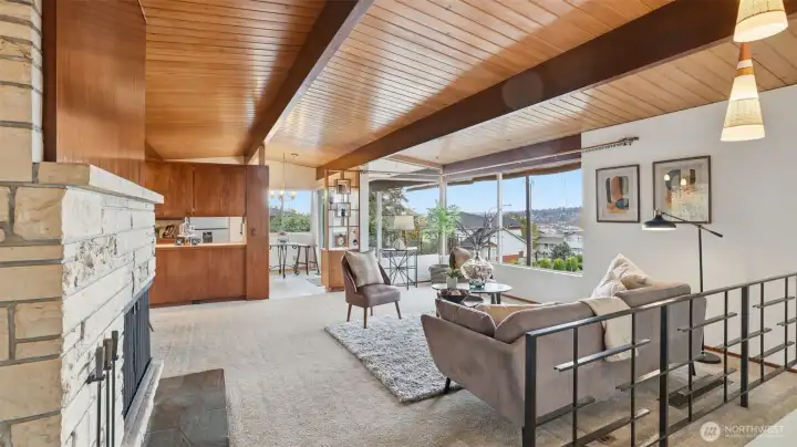 Original Missouri hardwoods under carpet and custom light fixtures add to the mid-century modern charm