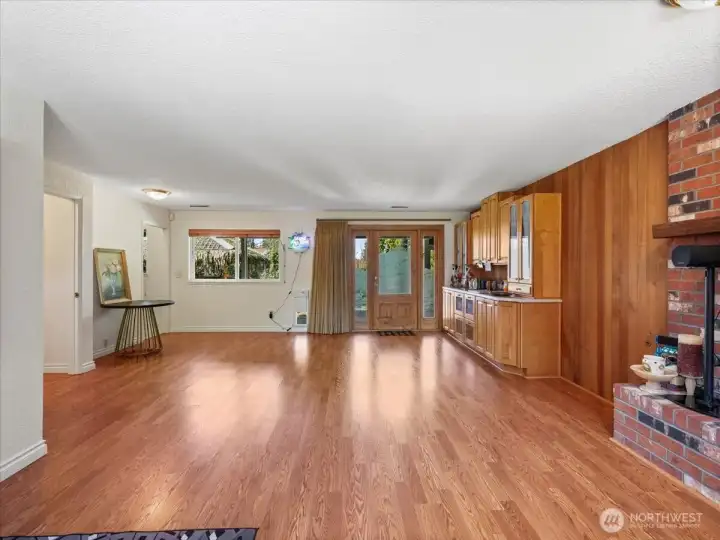 Doors open to the amazing back yard from lower level family room