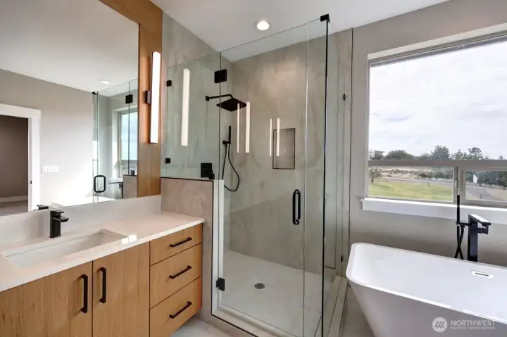 Large glass shower and soaking tub