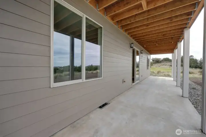 Downstairs patio, runs full length of home