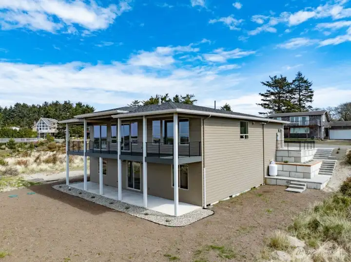 West side of home showing spacious decks on both levels