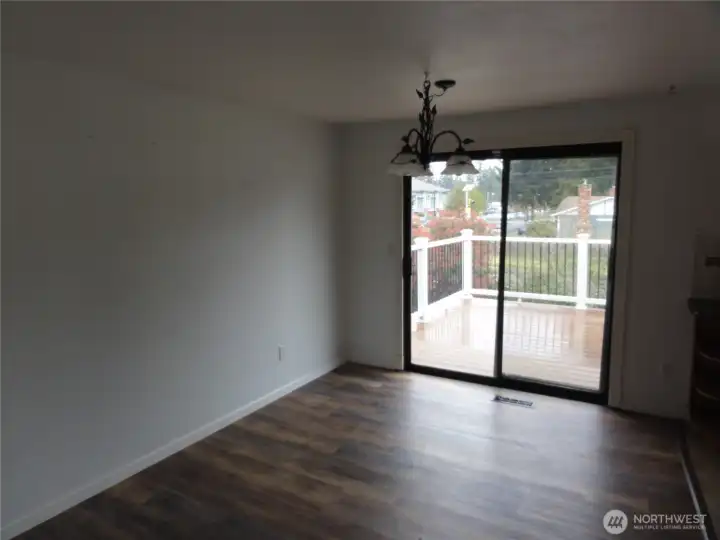 Eating area off kitchen with slider to deck. Eating area off kitchen with slider to deck.
