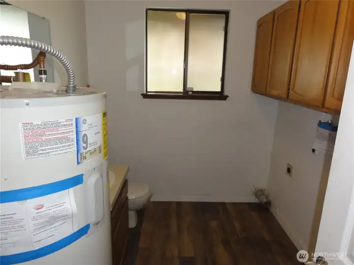 Laundry and half bathroom. Laundry and half bathroom.