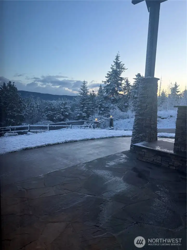 Front yard view off patio in winter