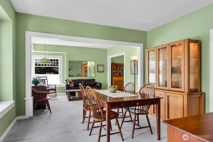 Dining room with living room in background