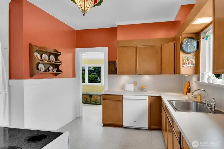 Spacious kitchen with adjacent den/office through doorway
