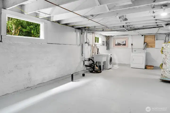 The utility room is located in the basement, along with plumbing drains for a potential future bathroom