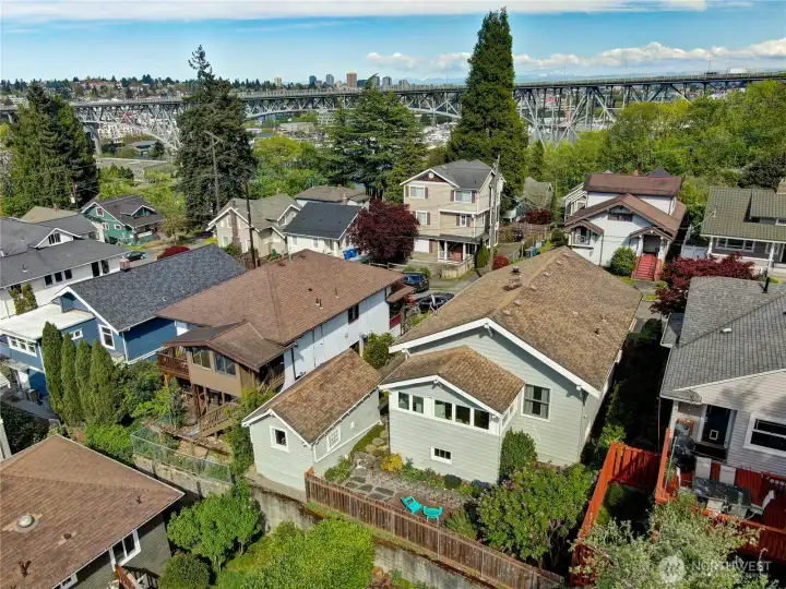 Aerial drone photo showing the back side of the home and the back yard/patio area