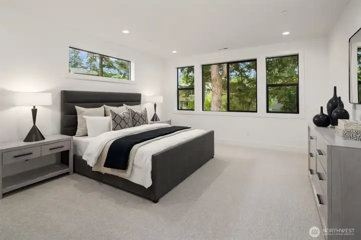 Designer primary suite with five-piece bath with heated floors
