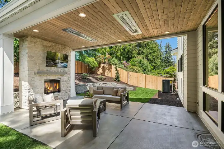 Private outdoor covered living area with fireplace
