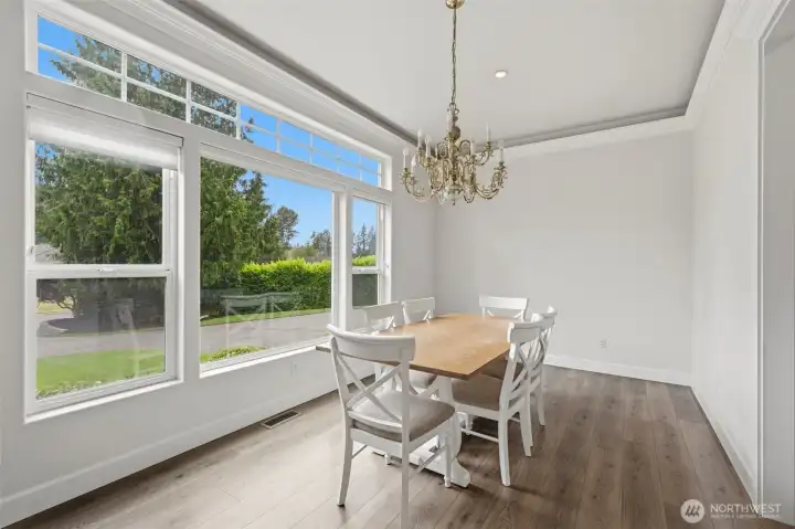 Formal dining room looks out onto the gorgeous front lawn area Formal dining room looks out onto the gorgeous front lawn area