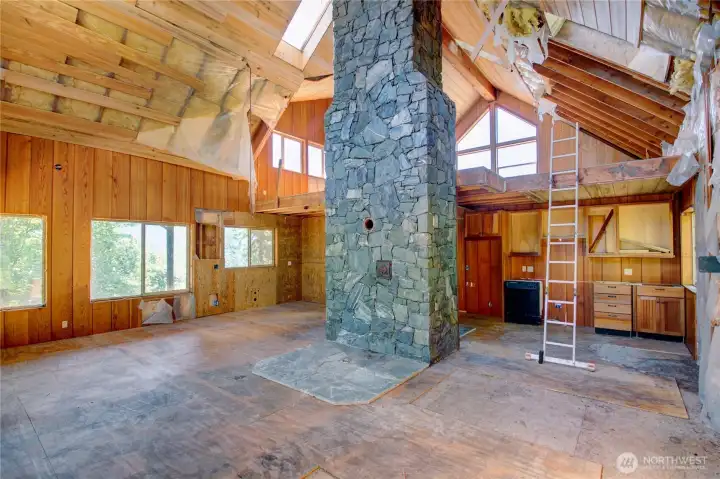 Gorgeous open concept layout with vaulted ceilings and rock chimany.