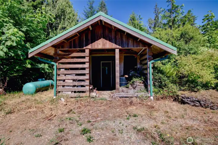 This out building holds the water pressure tank and at one time was the location of the gerenertor (no longer there).