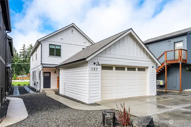 "Right Sized" 22' wide 2-Car Garage features a 240v Level-2 EV charging outlet.