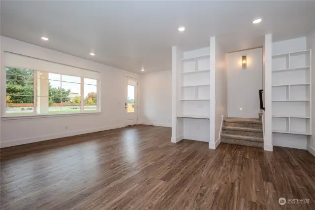 Attractive Luxury Vinyl Plank flooring, abundant recessed lighting & modern fixtures are found throughout the Main Floor. The Smart Home Center to the left of the stairway features built-in shelves & a data port. The Smart Home tablet serves as the home base for the Home Automation Suite. (video doorbells, lighting, thermostats, door locks & voice control functionality)