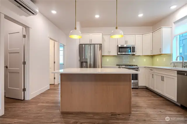 All Design Packages include stunning quartz counters with full tile backsplash, luxury vinyl plank flooring & striking contemporary lighting & hardware. Note the eat-in island, contrasting upper & lower cabinetry colors, under cabinet lighting and large energy efficient windows.